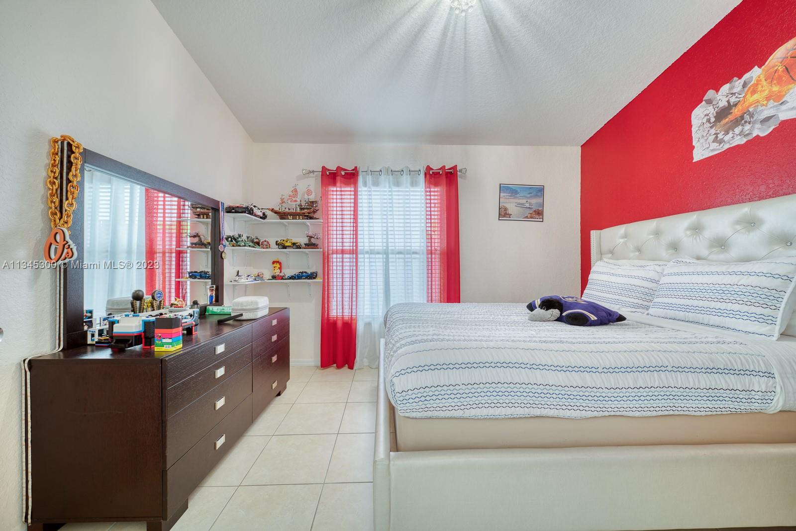 1635 Southeast 20th Place Homestead, FL 33035 - Photo 6 of 28 a living room with furniture and a flat screen tv