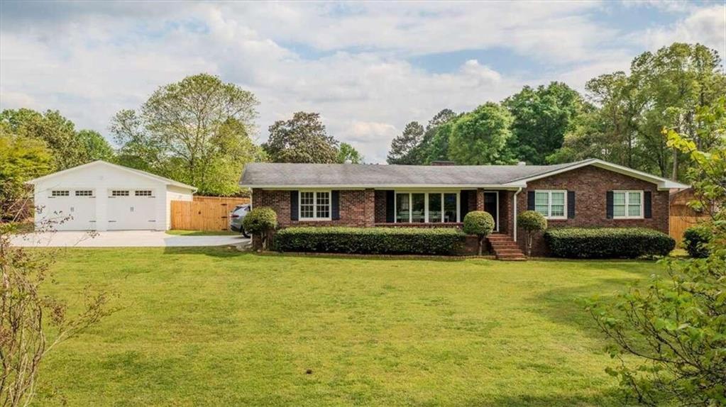 576 Lakeview Road Rockmart, GA 30153 - Photo 1 of 1 a front view of a house with a yard