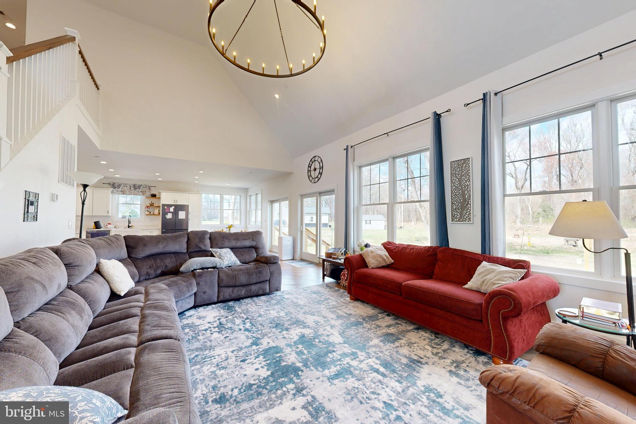 23730 Henry Road Ridgely, MD 21660 - Photo 9 of 28 a living room with furniture ceiling fan and a large window