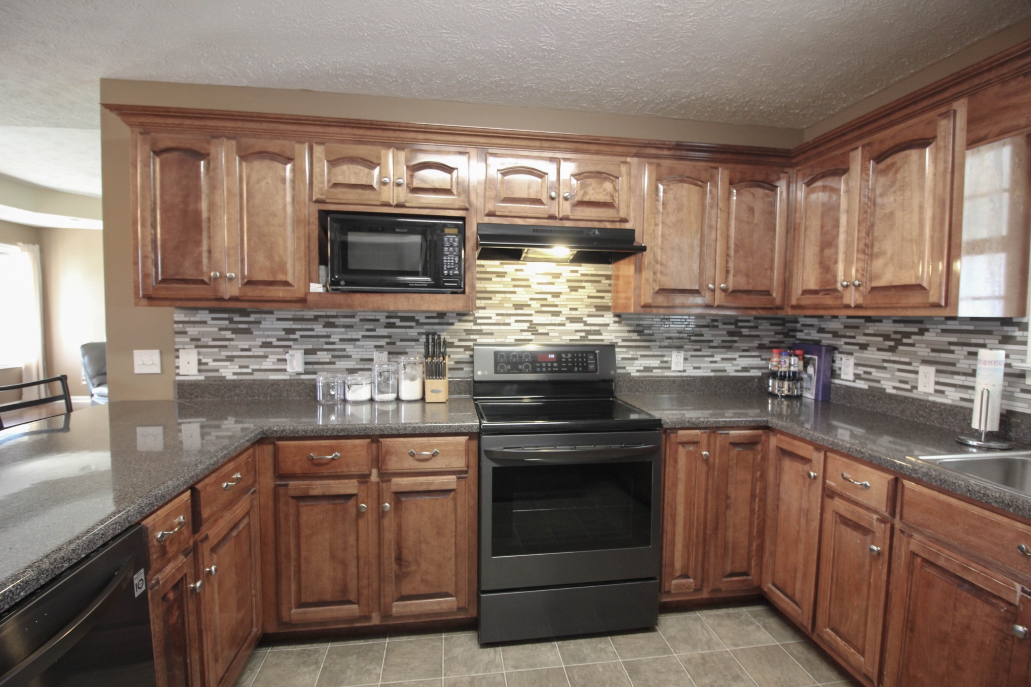 376 Spring Meadows Lane Morrison, TN 37357 - Photo 5 of 16 a kitchen with sink a microwave and cabinets