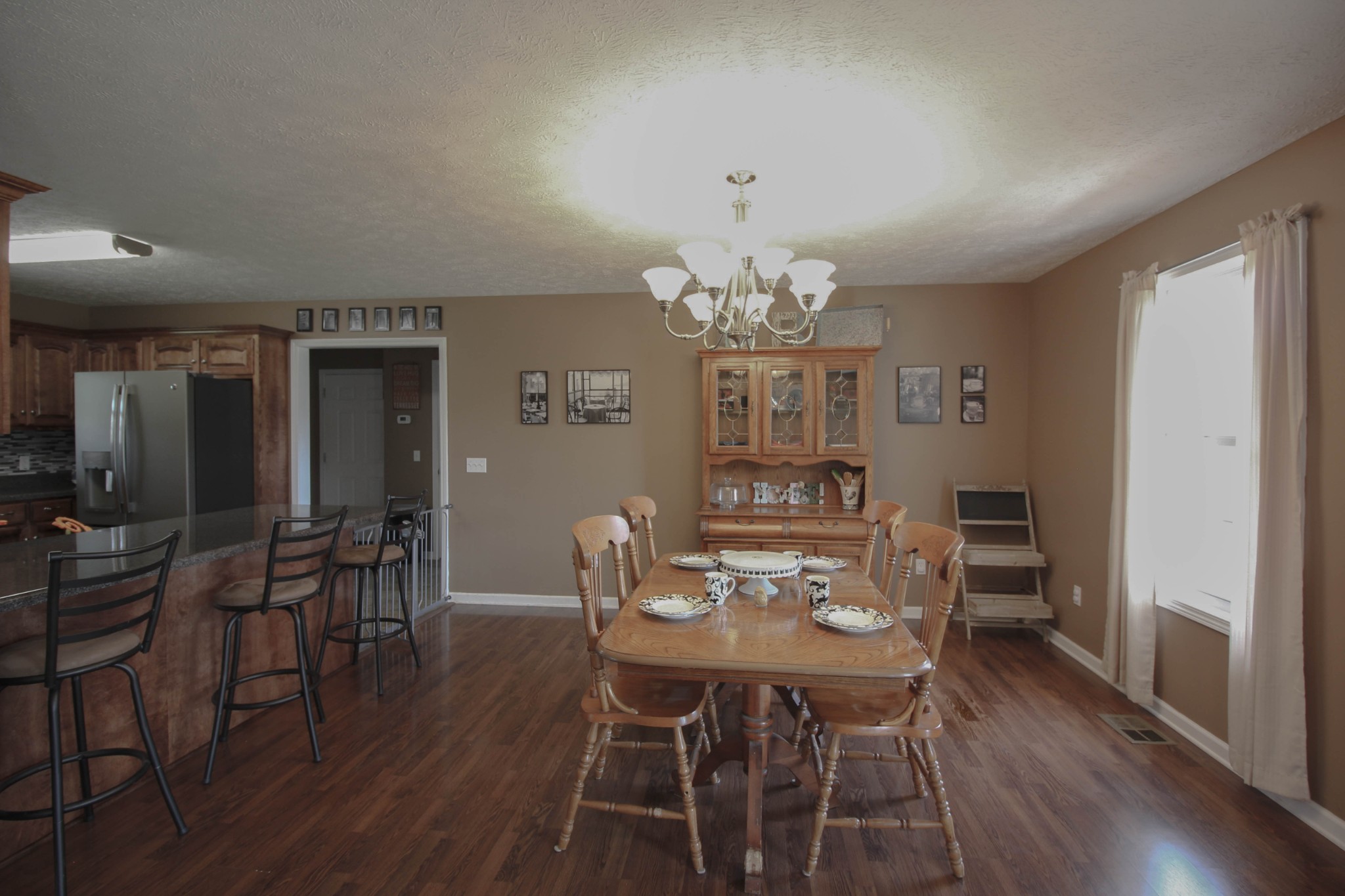 376 Spring Meadows Lane Morrison, TN 37357 - Photo 6 of 16 a view of a dining room with furniture and wooden floor