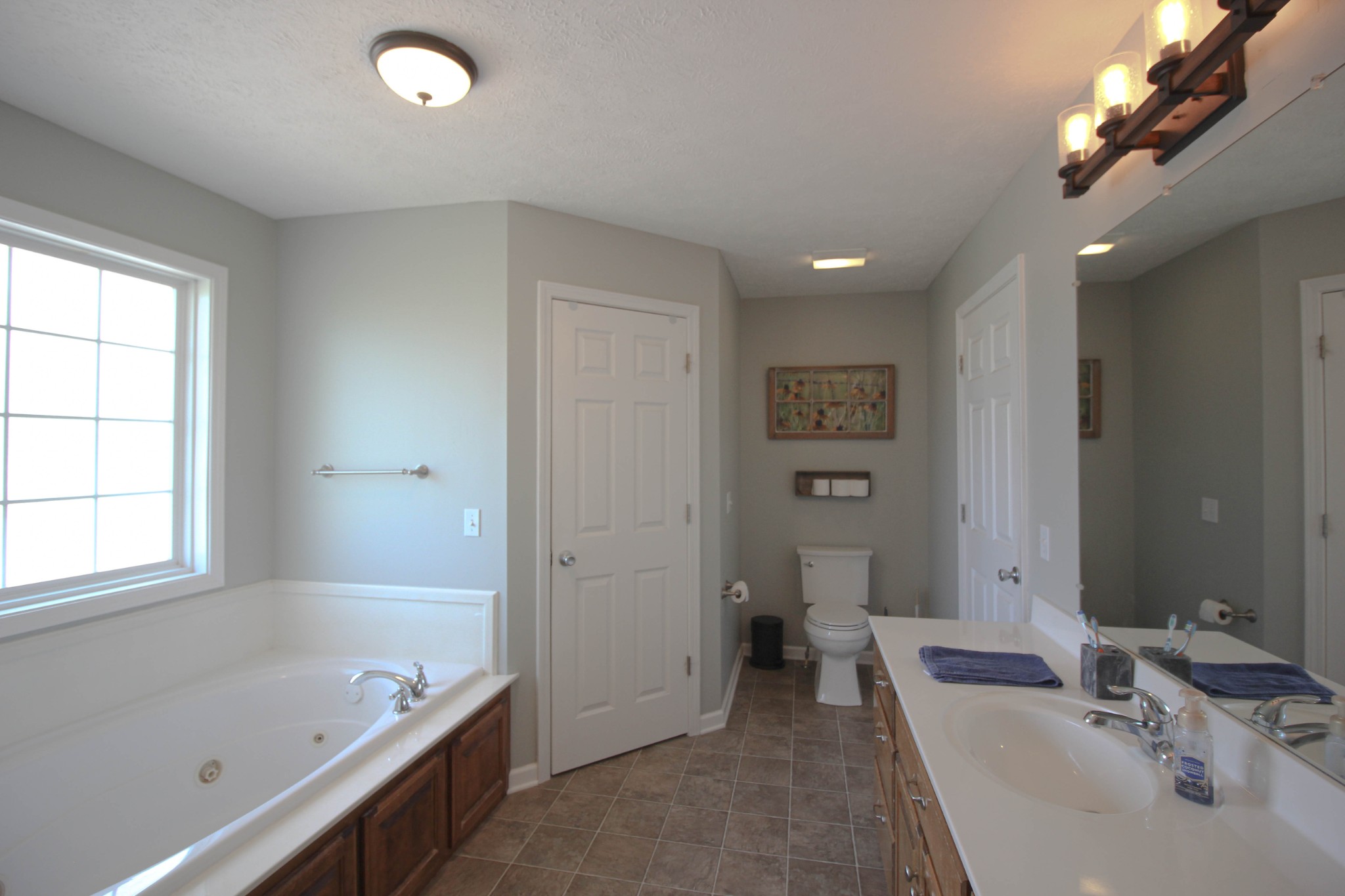 376 Spring Meadows Lane Morrison, TN 37357 - Photo 8 of 16 a bathroom with a tub sink and mirror