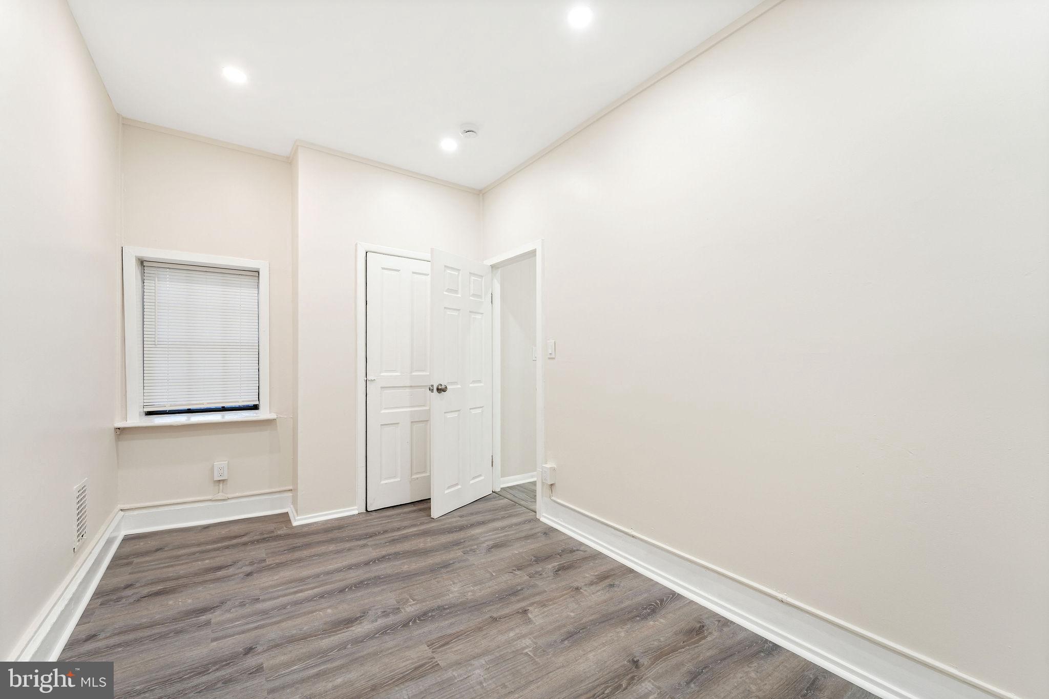 705 North 7th Street Camden, NJ 08102 - Photo 13 of 25 a view of an empty room with wooden floor
