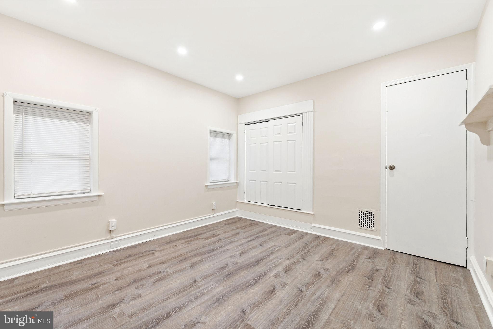 705 North 7th Street Camden, NJ 08102 - Photo 14 of 25 a view of an empty room with wooden floor and a window