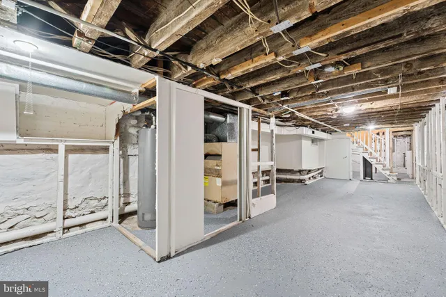 a view of empty room with wooden walls