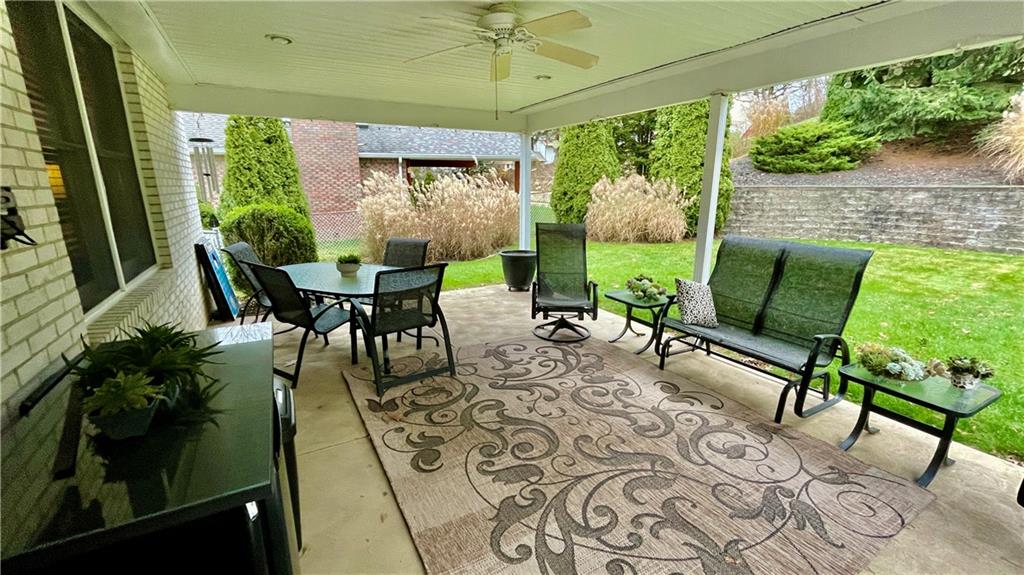 681 Adele Drive Irwin, PA 15642 - Photo 15 of 36 a view of a porch with chairs and backyard