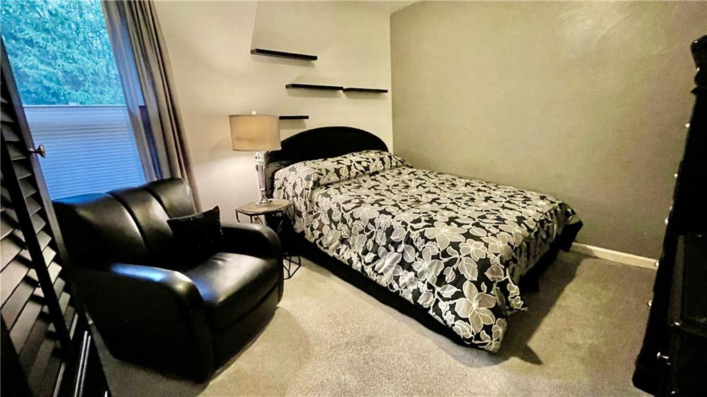 681 Adele Drive Irwin, PA 15642 - Photo 27 of 36 a bedroom with a bed couch and a fireplace