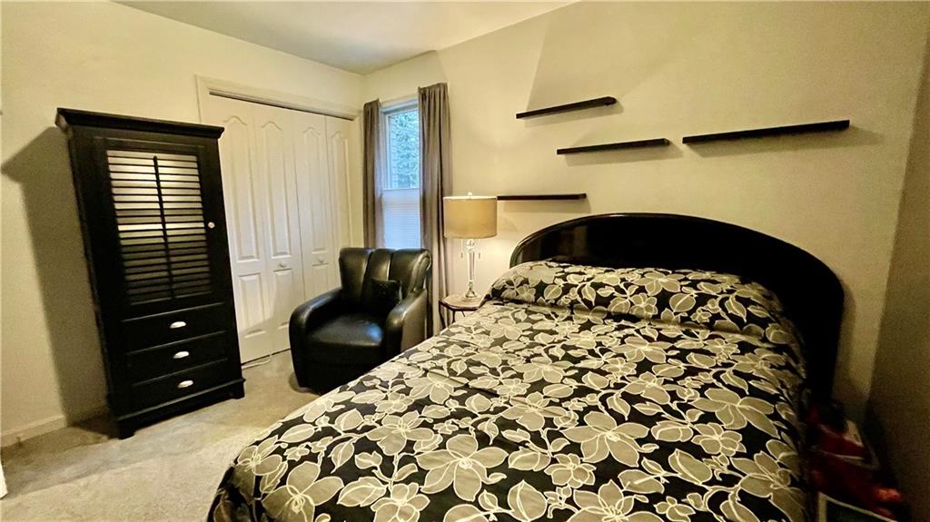 681 Adele Drive Irwin, PA 15642 - Photo 28 of 36 a bedroom with a bed and a television