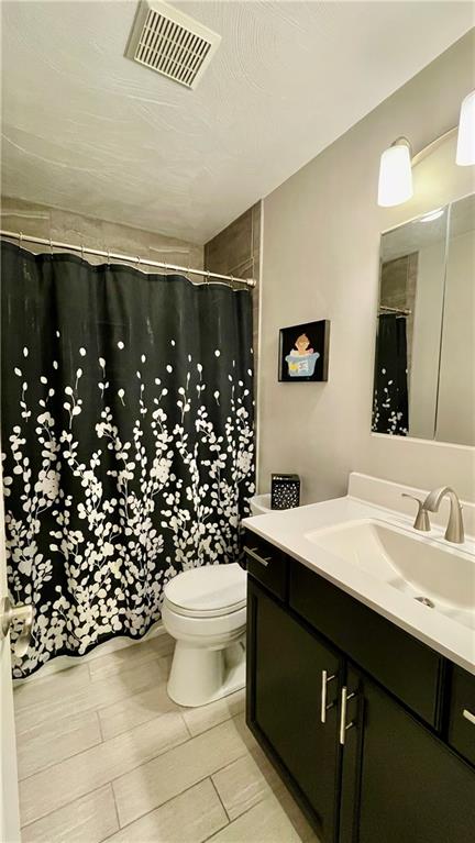 681 Adele Drive Irwin, PA 15642 - Photo 29 of 36 a bathroom with a sink toilet and shower