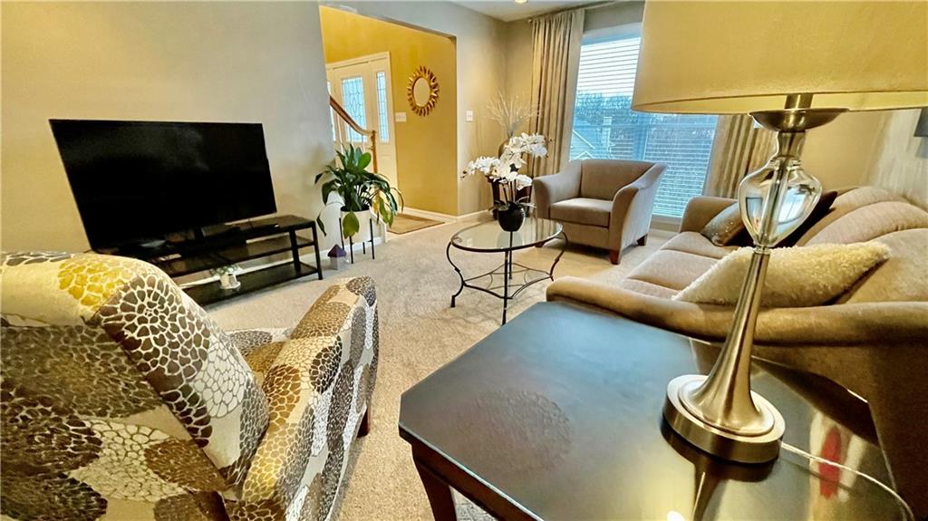 681 Adele Drive Irwin, PA 15642 - Photo 8 of 36 a living room with furniture and a flat screen tv