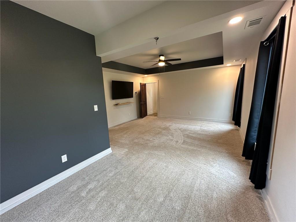 1001 Bailey Road Rome, GA 30161 - Photo 43 of 44 an empty room with wooden floor and a ceiling fan