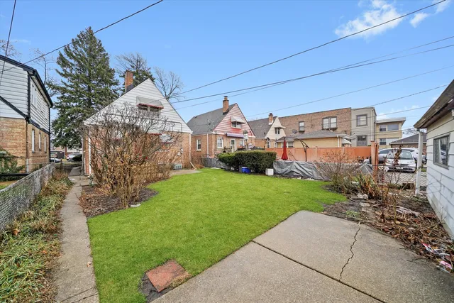 aerial view of a house with a yard