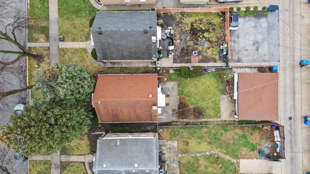 an aerial view of residential houses with city view