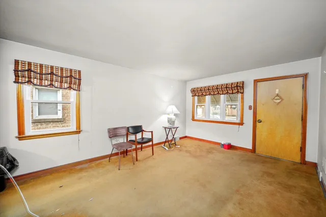 a bed room with a bed and a window