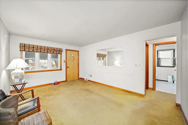 a view of an empty room with windows