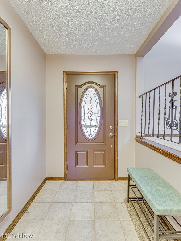 507 Everhard Road Southwest North Canton, OH 44709 - Photo 7 of 30 Tiled floor entry on main level.