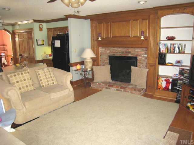 4804 Lancashire Drive Raleigh, NC 27613 - Photo 7 of 10 a living room with furniture and a fireplace