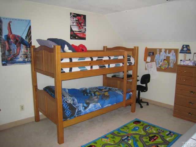 4804 Lancashire Drive Raleigh, NC 27613 - Photo 10 of 10 a bedroom with a bed and furniture