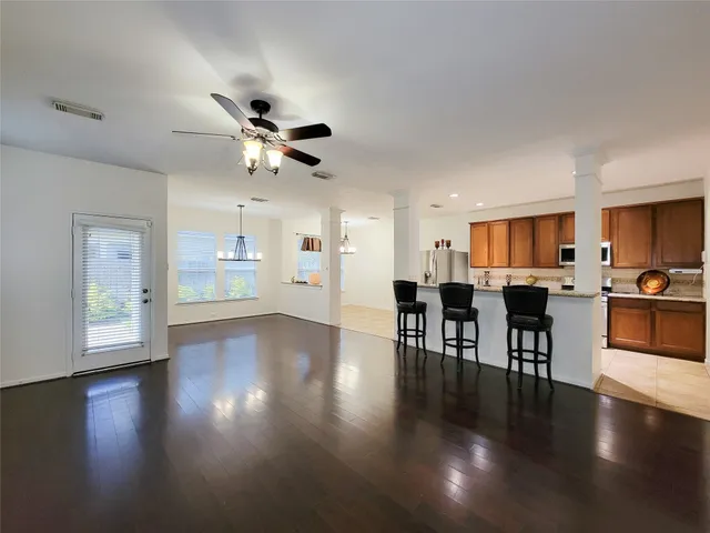 a view of a dining room with furniture and wooden floor