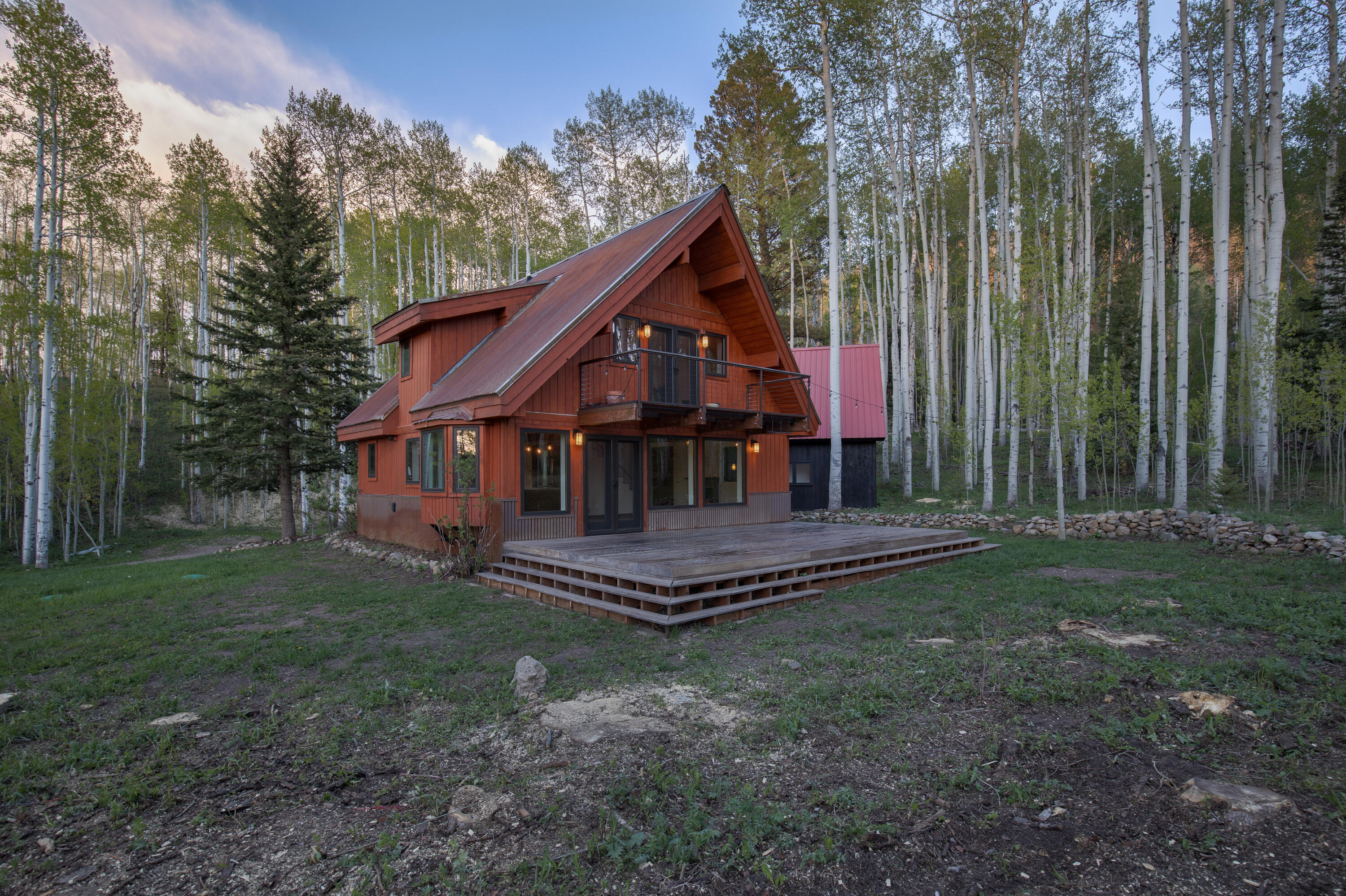 a view of a house with a yard porch and sitting area