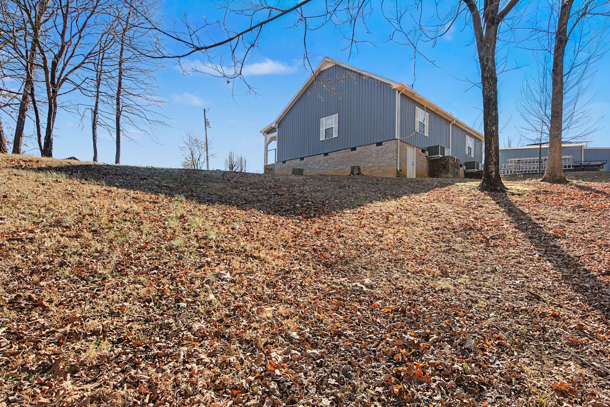 1075 Coker Ford Road Portland, TN 37148 - Photo 34 of 35 a view of a house with a yard