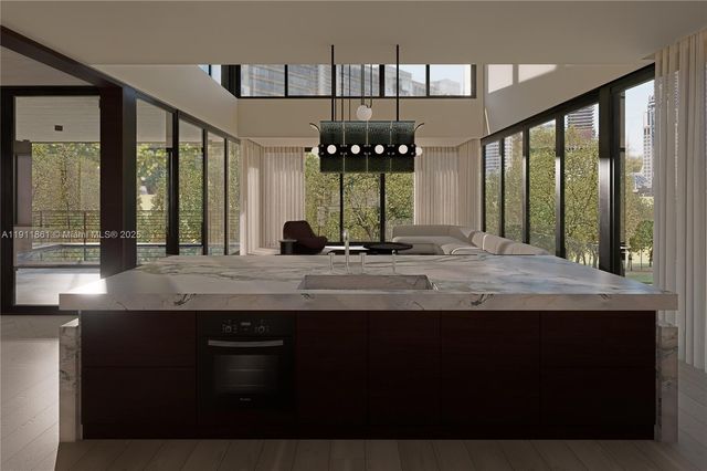 a bathroom with a granite countertop sink and a large mirror