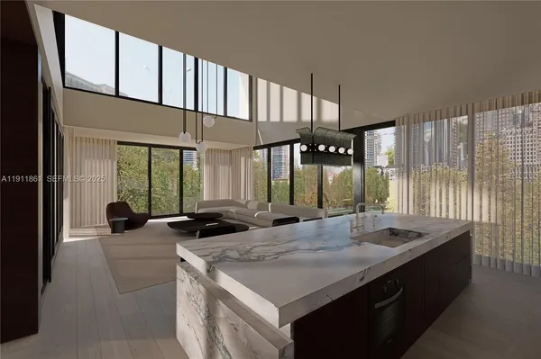 a kitchen with counter top space and living room