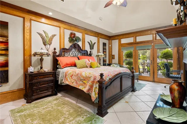 a bedroom with a bed and a fireplace