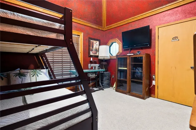 a bedroom with furniture and a window