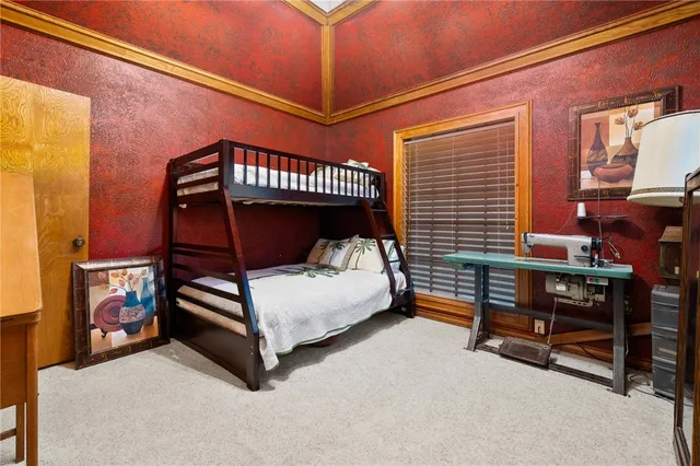 a room with a bed and a television