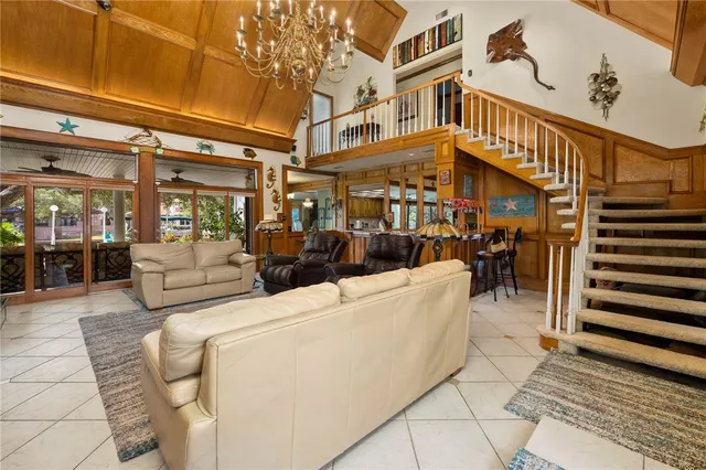 a living room with furniture a lamp and a window