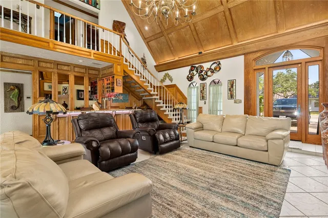 a balcony with furniture and a large window