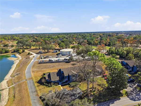an aerial view of a house with a ocean view