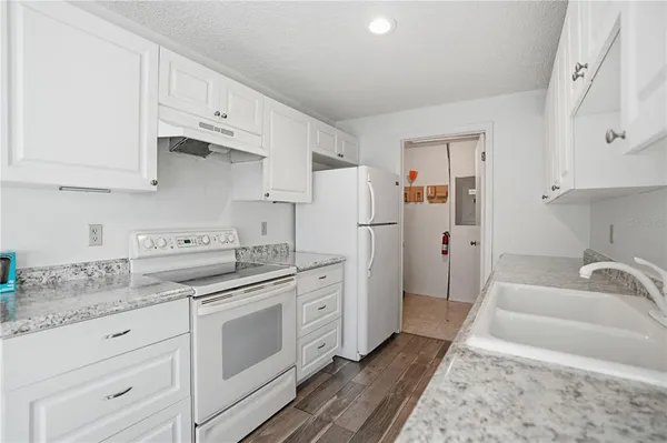 a spacious bathroom with a granite countertop sink and a granite top