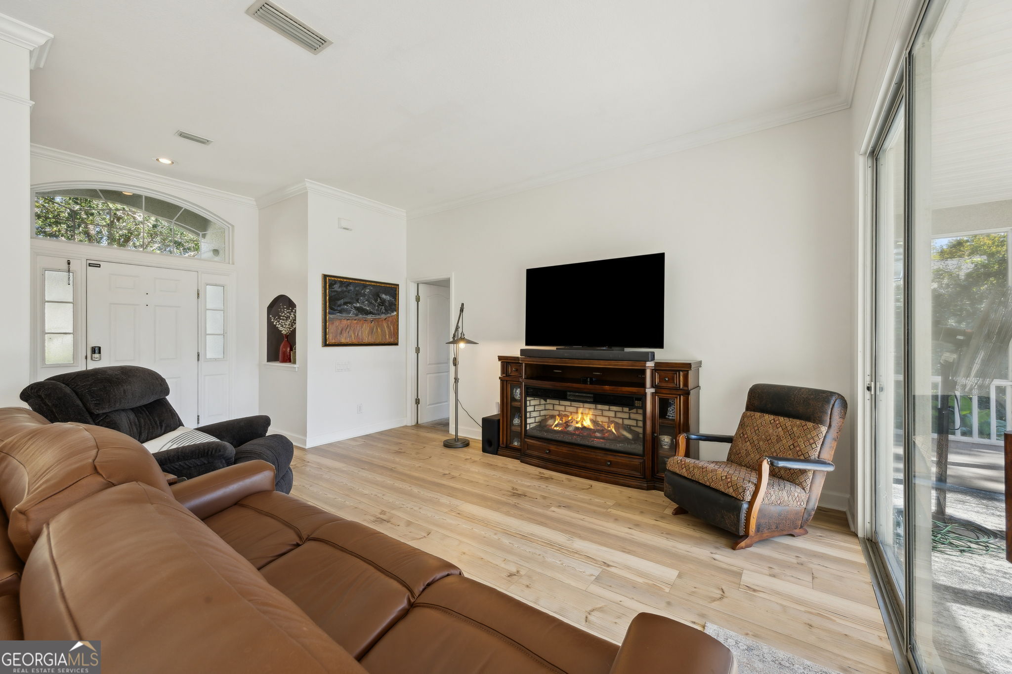 502 Cardinal Circle East St. Marys, GA 31558 - Photo 12 of 73 a living room with furniture and a flat screen tv
