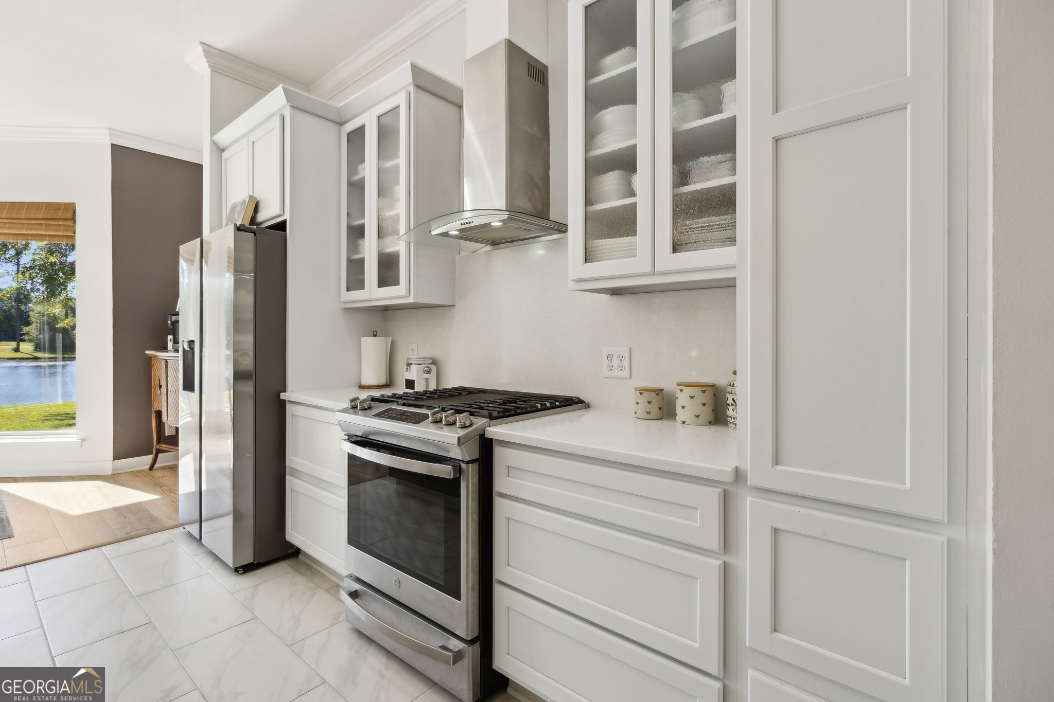 502 Cardinal Circle East St. Marys, GA 31558 - Photo 17 of 73 a kitchen with stainless steel appliances granite countertop white cabinets and a stove