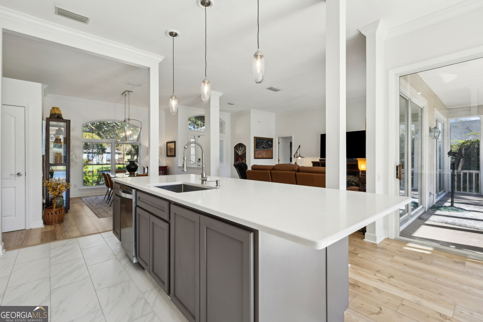 502 Cardinal Circle East St. Marys, GA 31558 - Photo 18 of 73 a large kitchen with stainless steel appliances kitchen island a large counter top and a view of living room