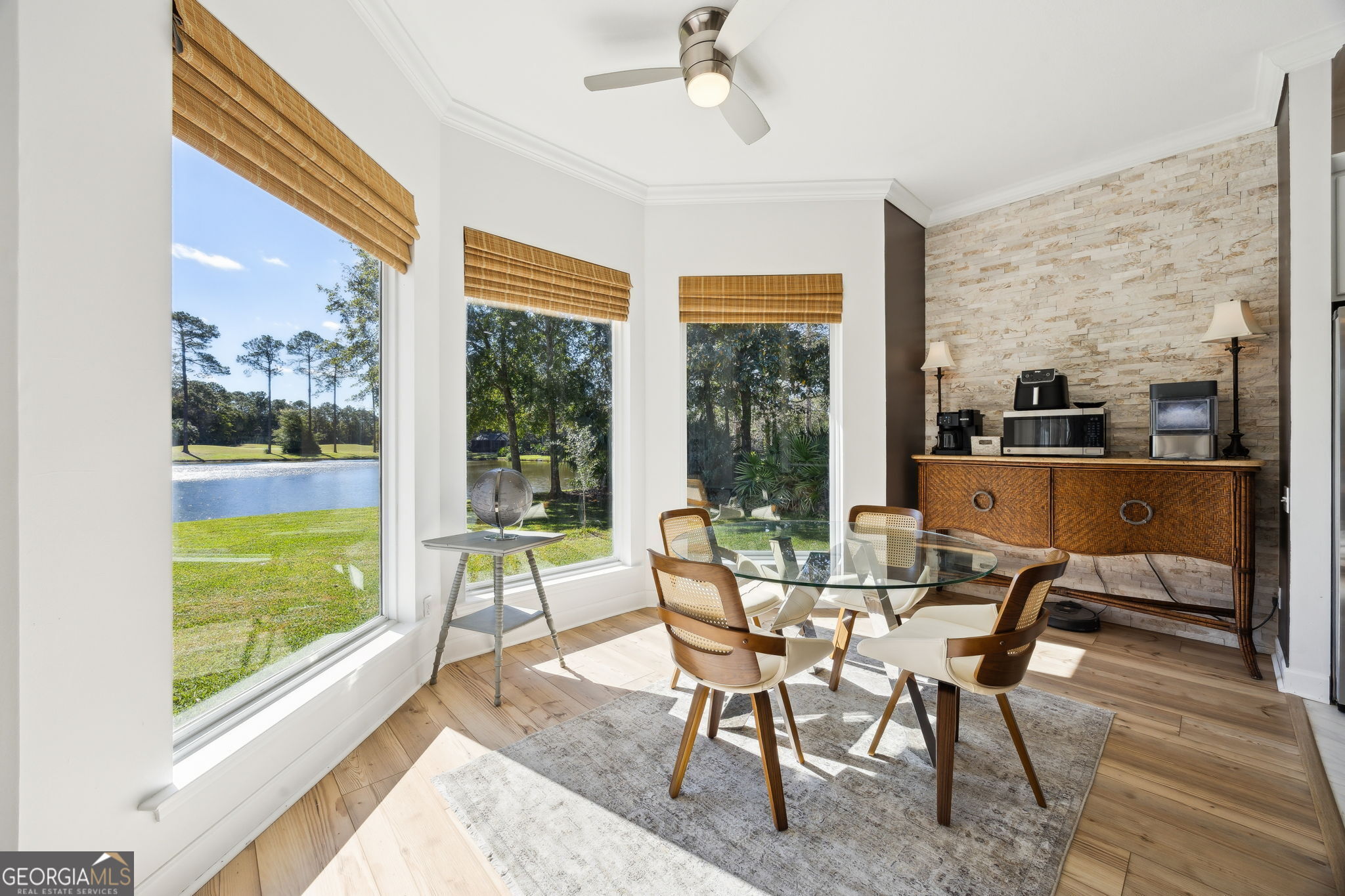 502 Cardinal Circle East St. Marys, GA 31558 - Photo 21 of 73 a view of a dining room with furniture large windows and wooden floor