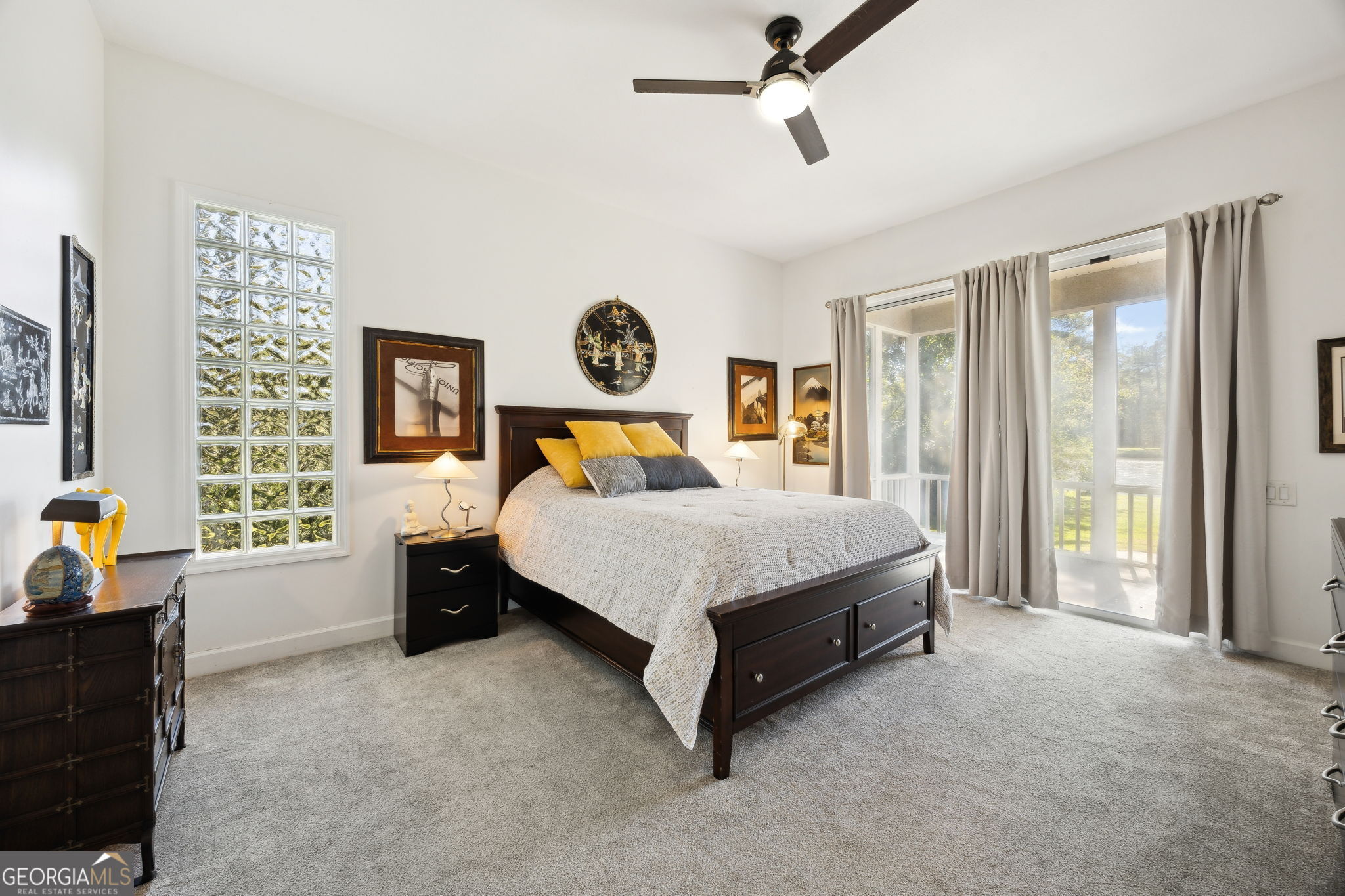 502 Cardinal Circle East St. Marys, GA 31558 - Photo 24 of 73 a bed sitting in a spacious bedroom next to a window and a chair