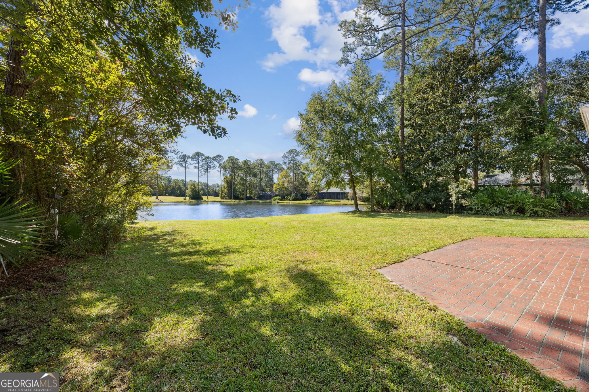 502 Cardinal Circle East St. Marys, GA 31558 - Photo 41 of 73 a view of yard with swimming pool and green space