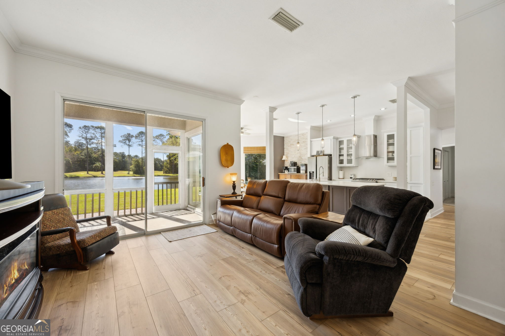 502 Cardinal Circle East St. Marys, GA 31558 - Photo 9 of 73 a living room with furniture and a large window