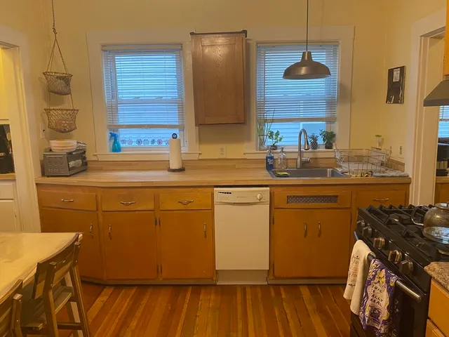 a kitchen with sink and cabinets