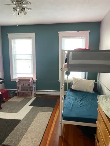 a living room with a couch and a chandelier