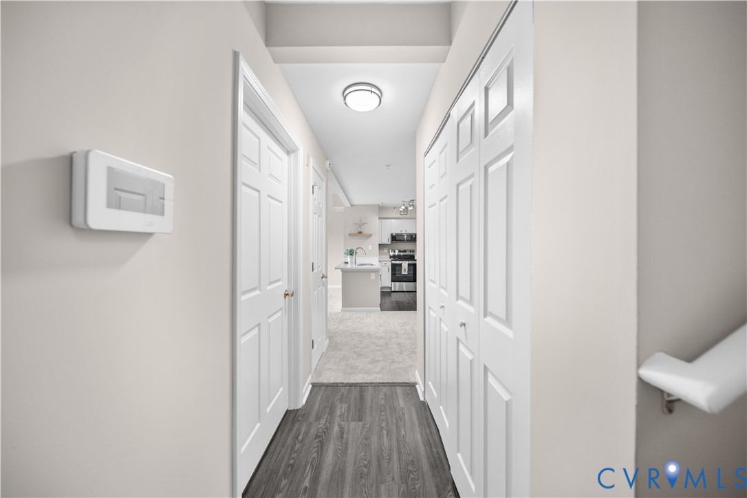620 Fern Meadow Loop, Unit 305 Midlothian, VA 23114 - Photo 15 of 17 a view of a hallway with wooden floor and staircase