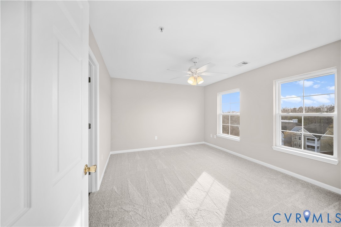 620 Fern Meadow Loop, Unit 305 Midlothian, VA 23114 - Photo 10 of 17 an empty room with windows