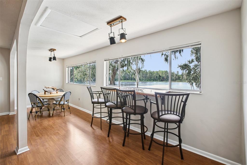 19254 Blount Road Lutz, FL 33558 - Photo 10 of 34 a dining room with furniture window wooden floor