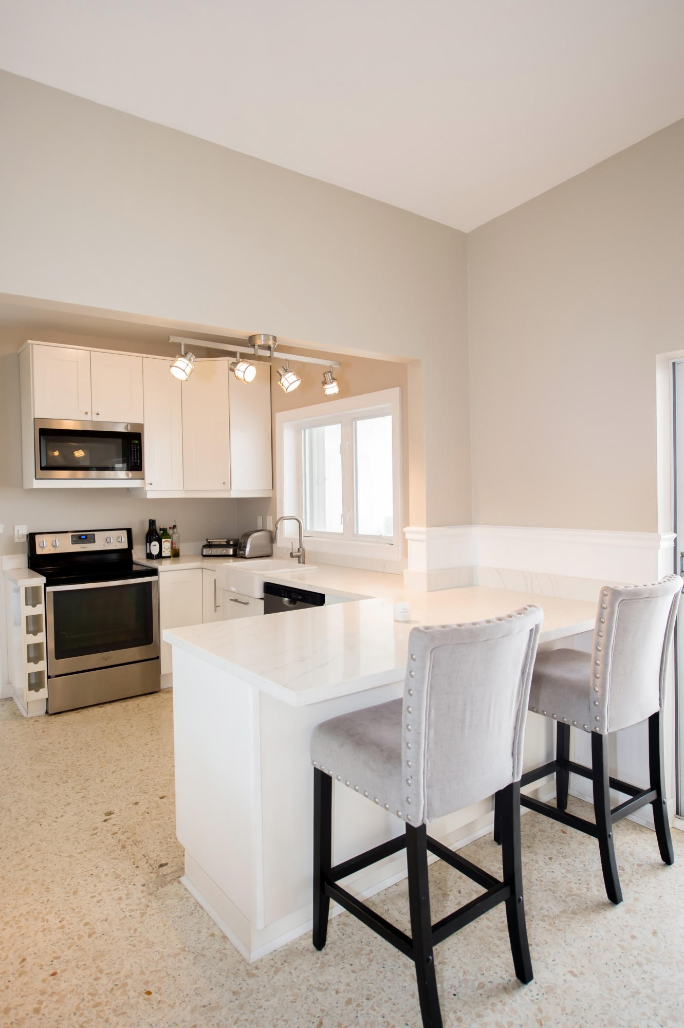 2 Allamanda Terrace Key West, FL 33040 - Photo 11 of 29 a kitchen with a dining table chairs and a refrigerator