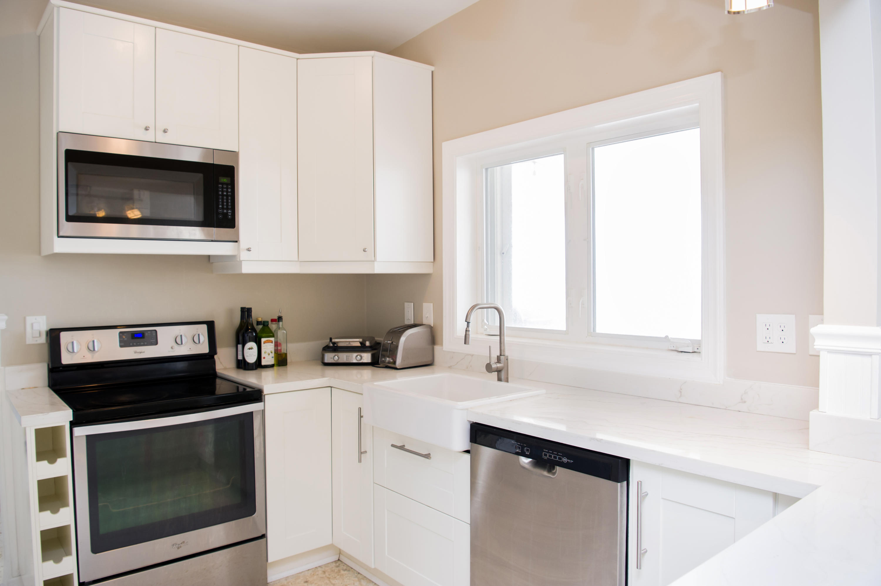 2 Allamanda Terrace Key West, FL 33040 - Photo 12 of 29 a kitchen with stainless steel appliances white cabinets and a sink