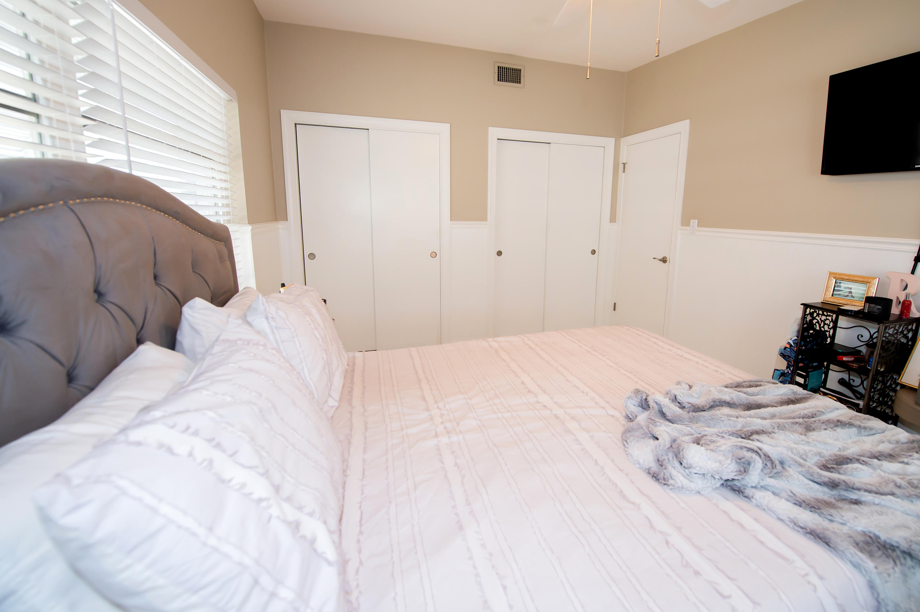 2 Allamanda Terrace Key West, FL 33040 - Photo 15 of 29 a bedroom with a bed a flat screen tv and dresser