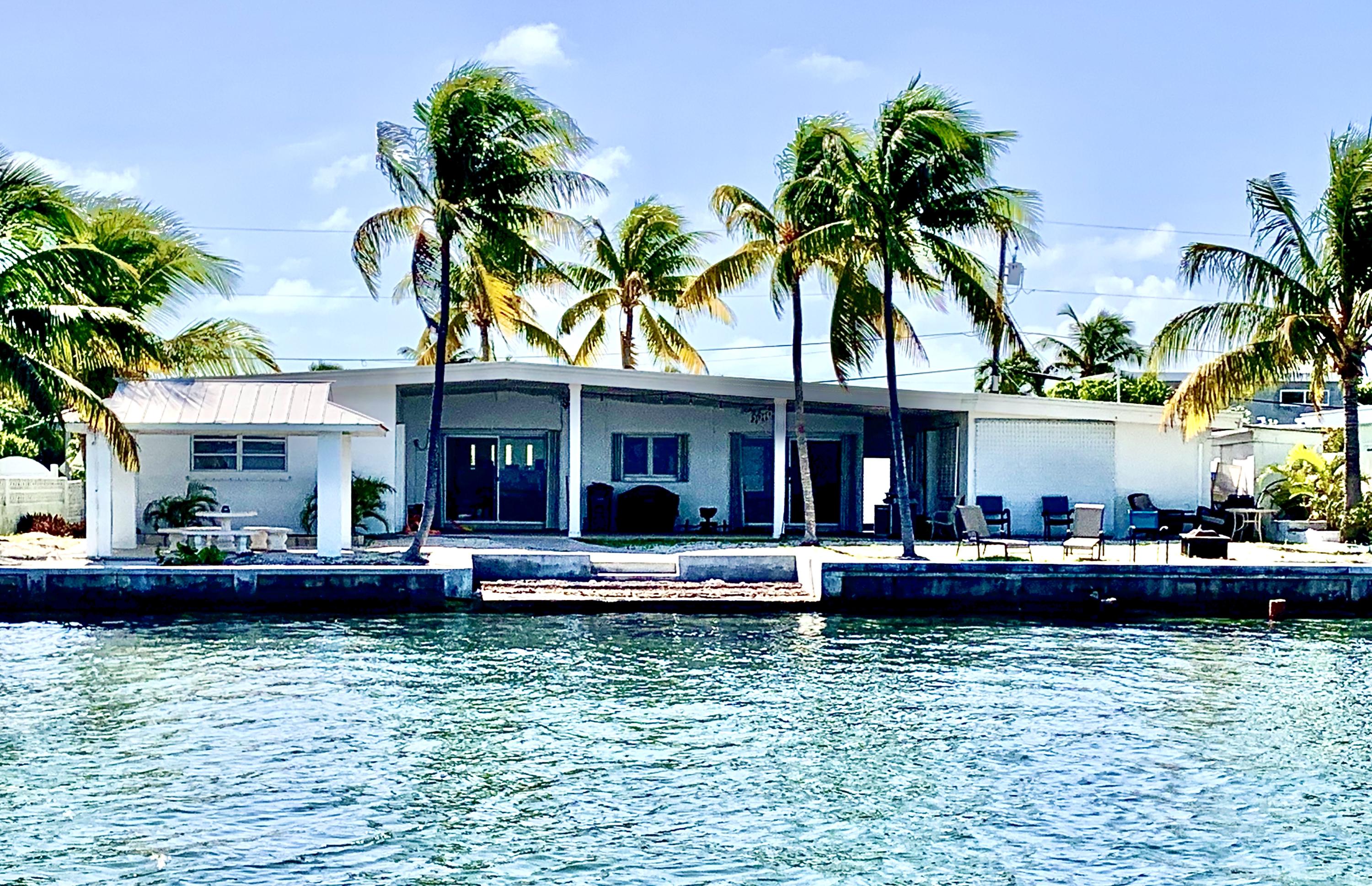 2 Allamanda Terrace Key West, FL 33040 - Photo 19 of 29 a front view of a house with swimming pool and furniture
